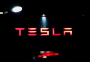 tesla logo on a stage