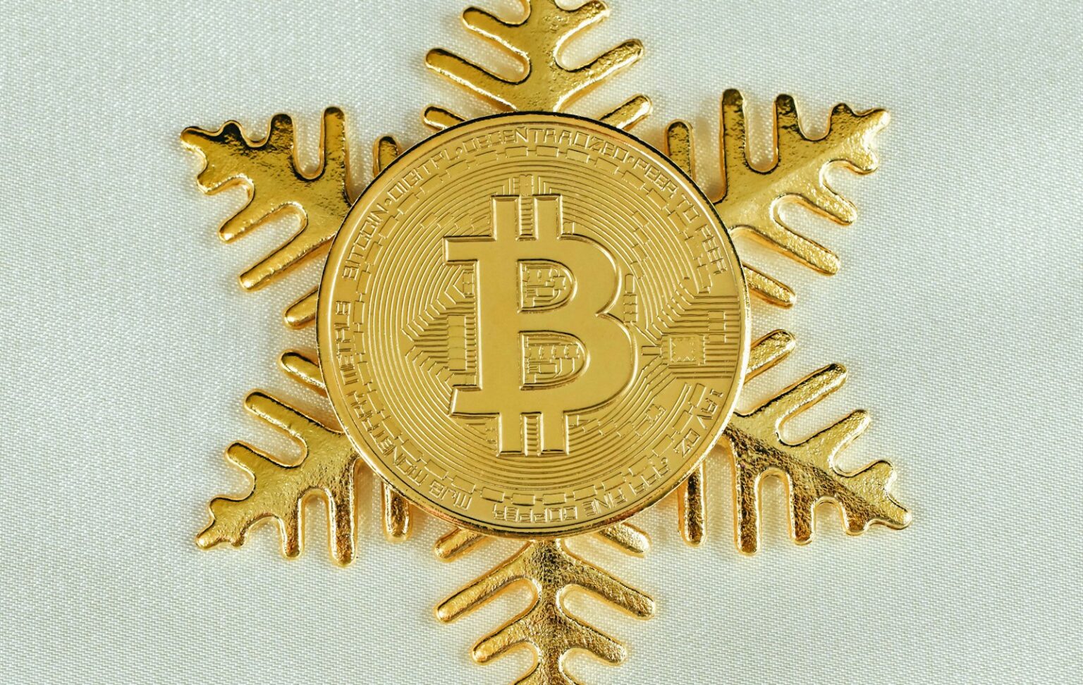 a bitcoin snowflake with a bitcoin on it